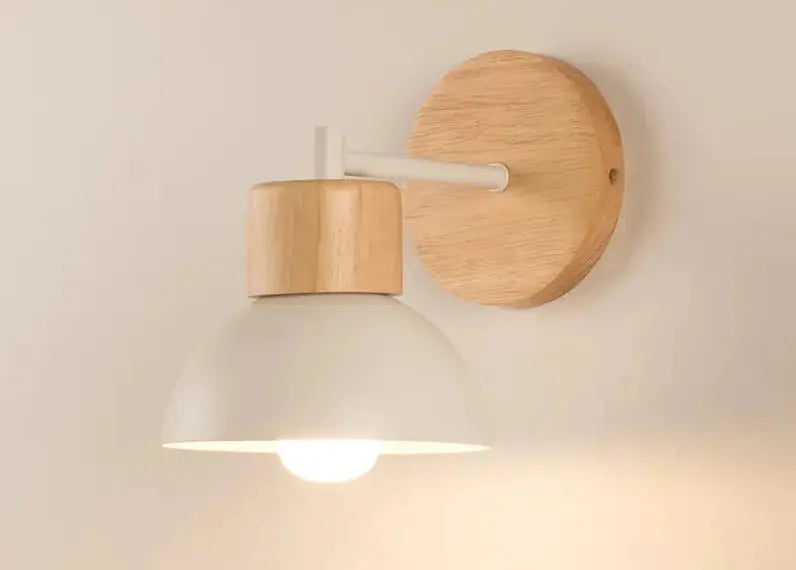 Wooden wall lamp with a light bulb on a plain background