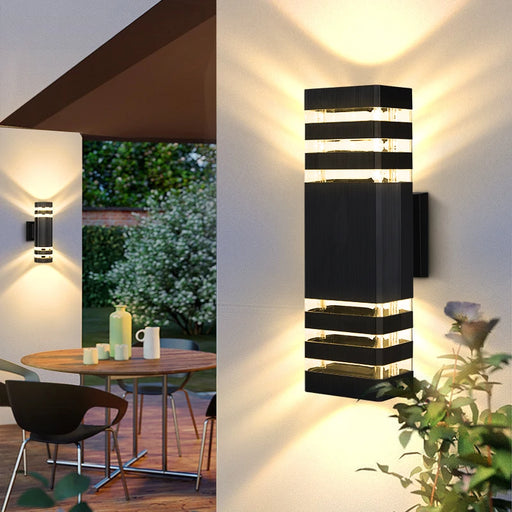Modern outdoor wall lights with a patio and garden view.